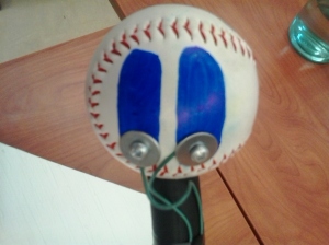 Baseball with wired contact points.